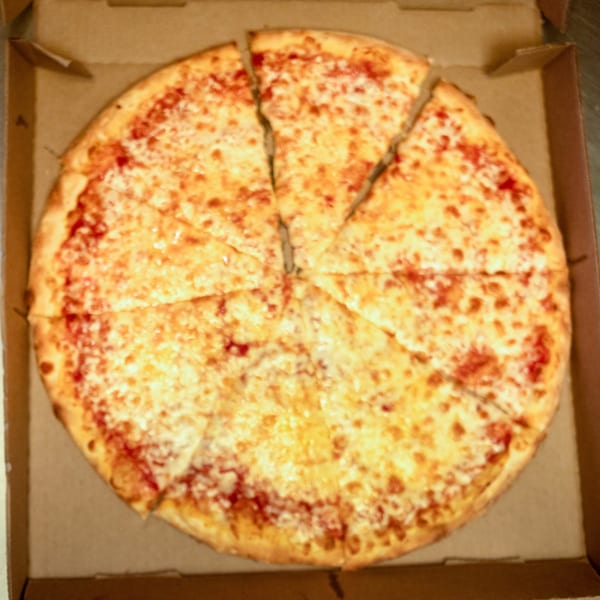 A whole cheese pizza, cut into eight slices, sits inside an open cardboard delivery box.